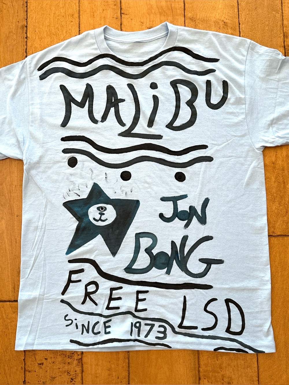 Malibu Jon B Surf Graphic T‑Shirt in Light Blue